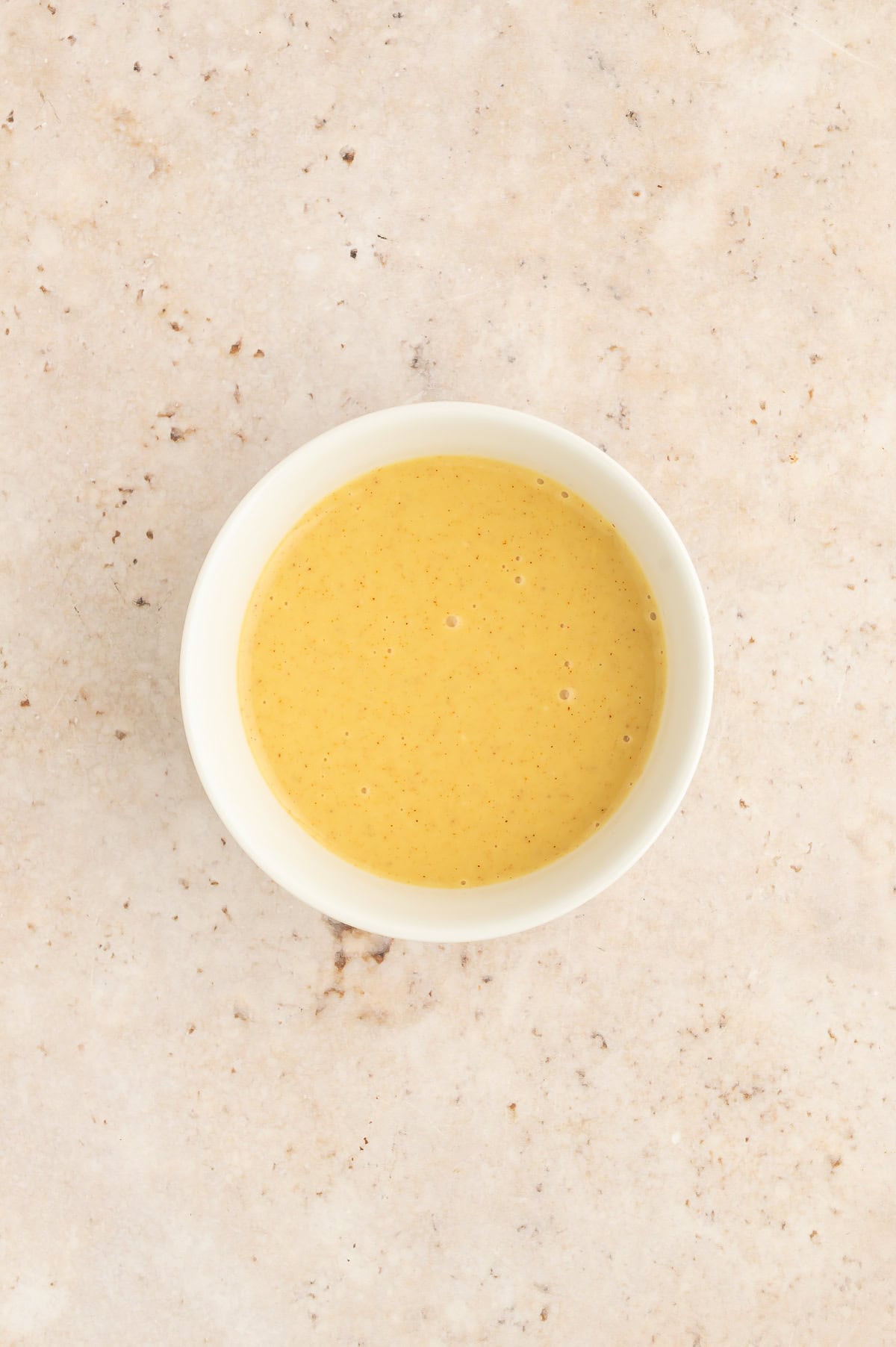 Bowl of mixed maple mustard dip.