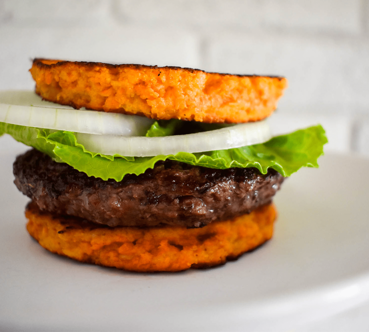 paleo-sweet-potato-burger-bun-on-plate-foodborne-wellness