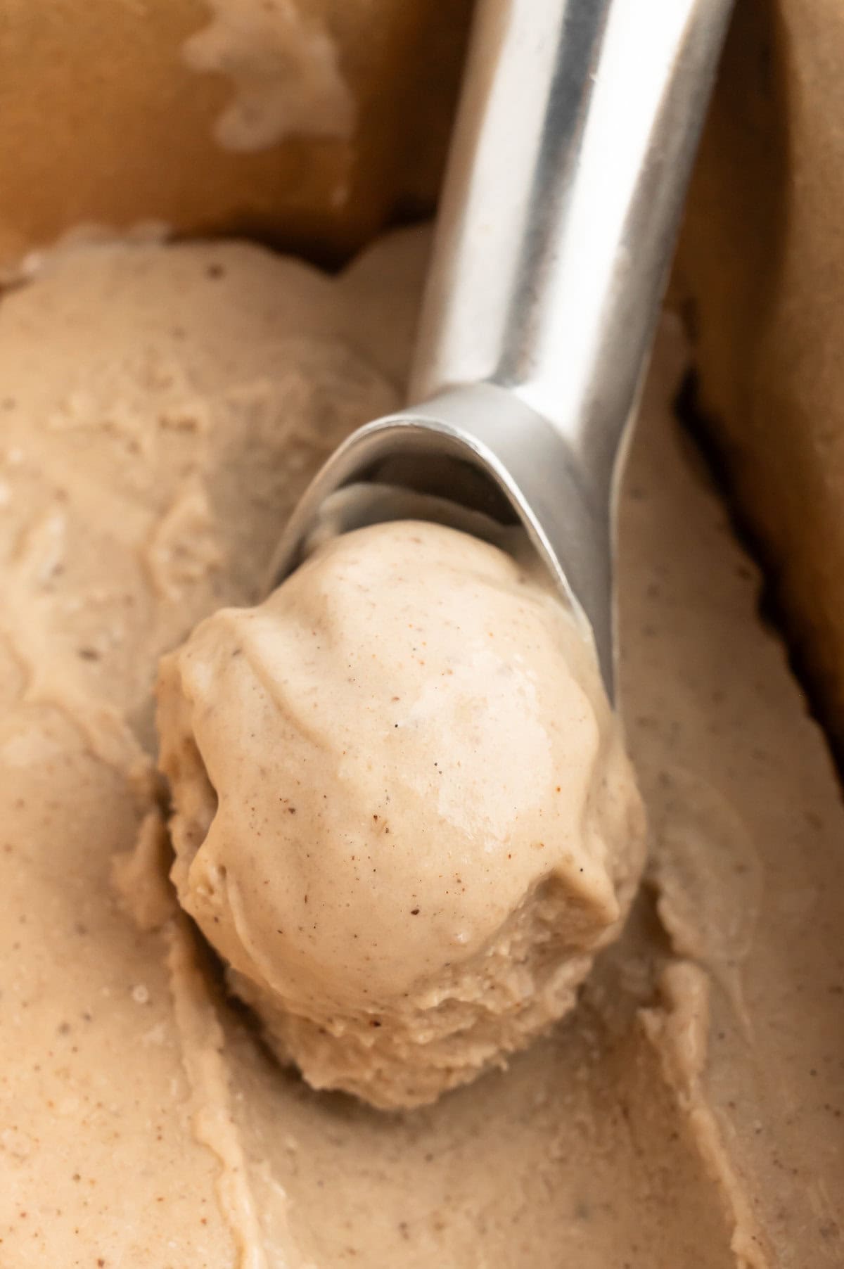 Scooping vegan banana ice cream.