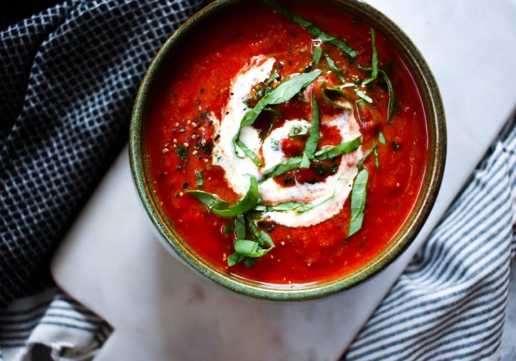Rich colored tomato soup with creamy coconut.