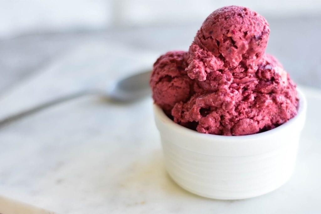 Paleo coconut berry ice cream with spoon