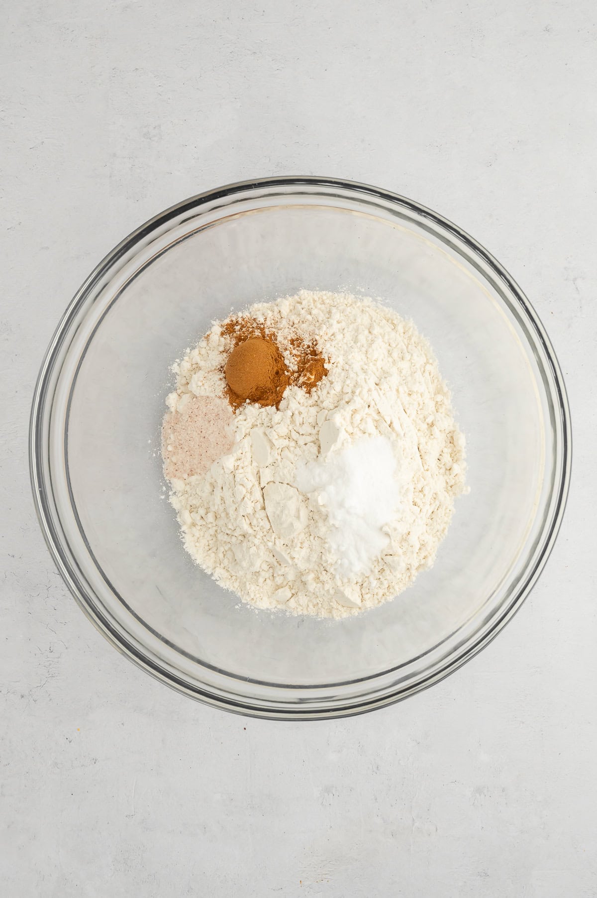 Mixing together dry ingredients for sugar-free gluten-free banana muffins.