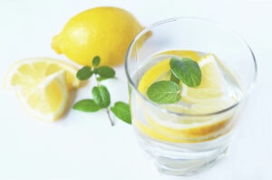 Glass of water with lemon and mint