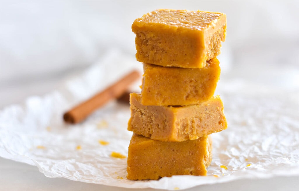 Stack of four pieces of pumpkin fudge