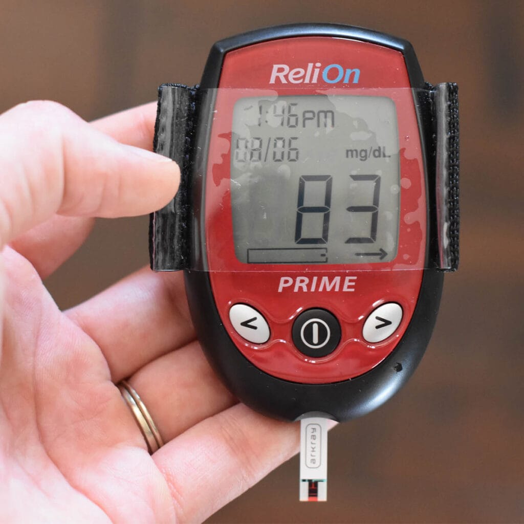 Glucometer reading 83 mg/dL.