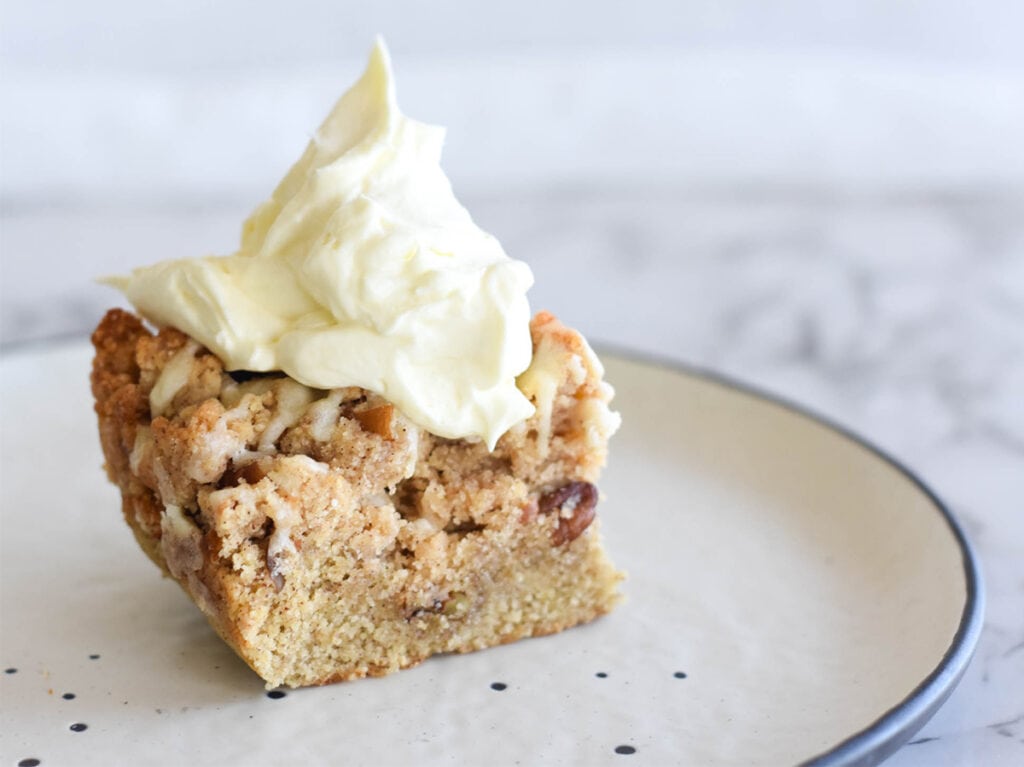 Coffee cake with large dollop of keto whipped cream.