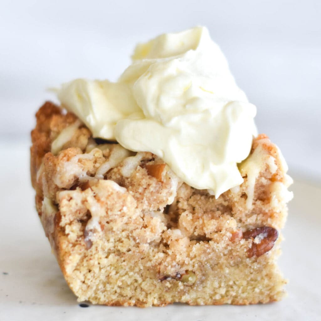 Coffee cake with large dollop of keto whipped cream.