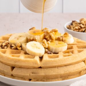 Crispy paleo waffles with bananas and walnuts.