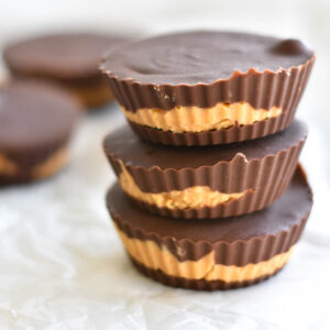 Stack of three keto peanut butter cups.
