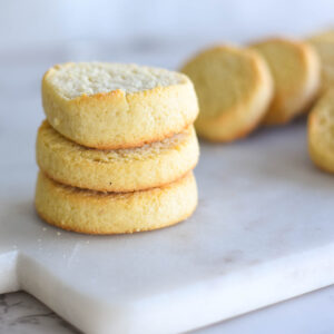 Stack of three golden buttery keto shortbread cookies.