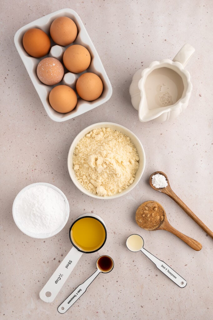 Ingredient shot with eggs, almond flour, tapioca starch, avocado oil, coconut sugar, baking powder, vanilla, almond milk and apple cider vinegar.