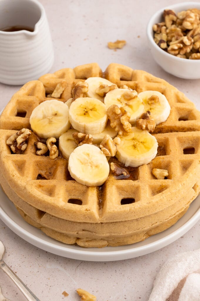 Crispy paleo waffles with bananas and walnuts.