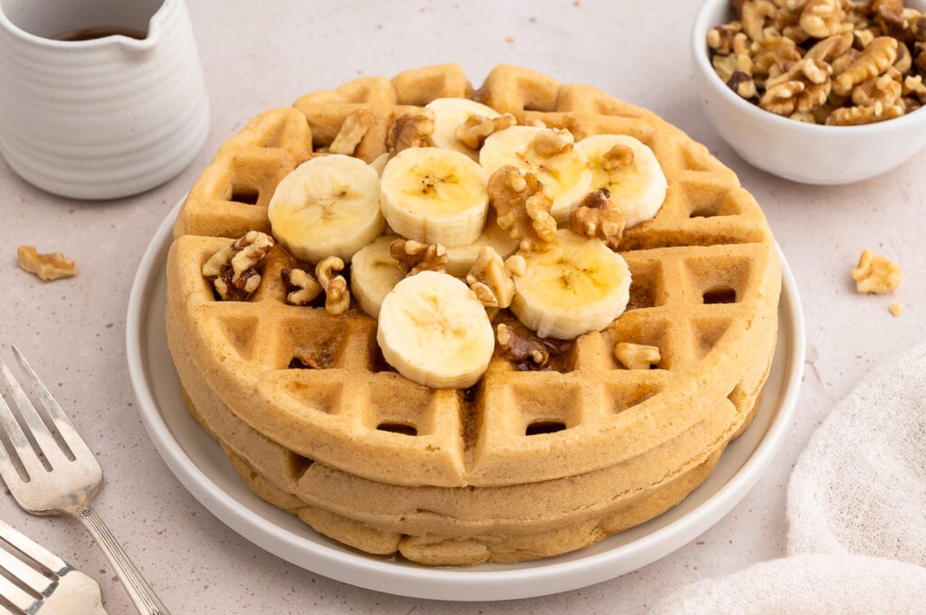 Crispy paleo waffles with bananas and walnuts.