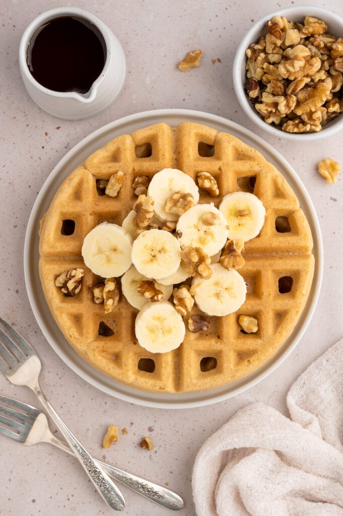 Crispy paleo waffles with bananas and walnuts.