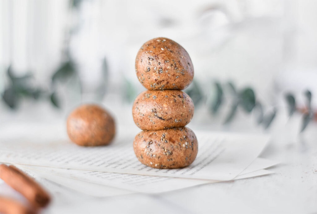 Stack of three chai spiced protein balls.