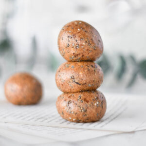 Stack of three chai spiced protein balls.