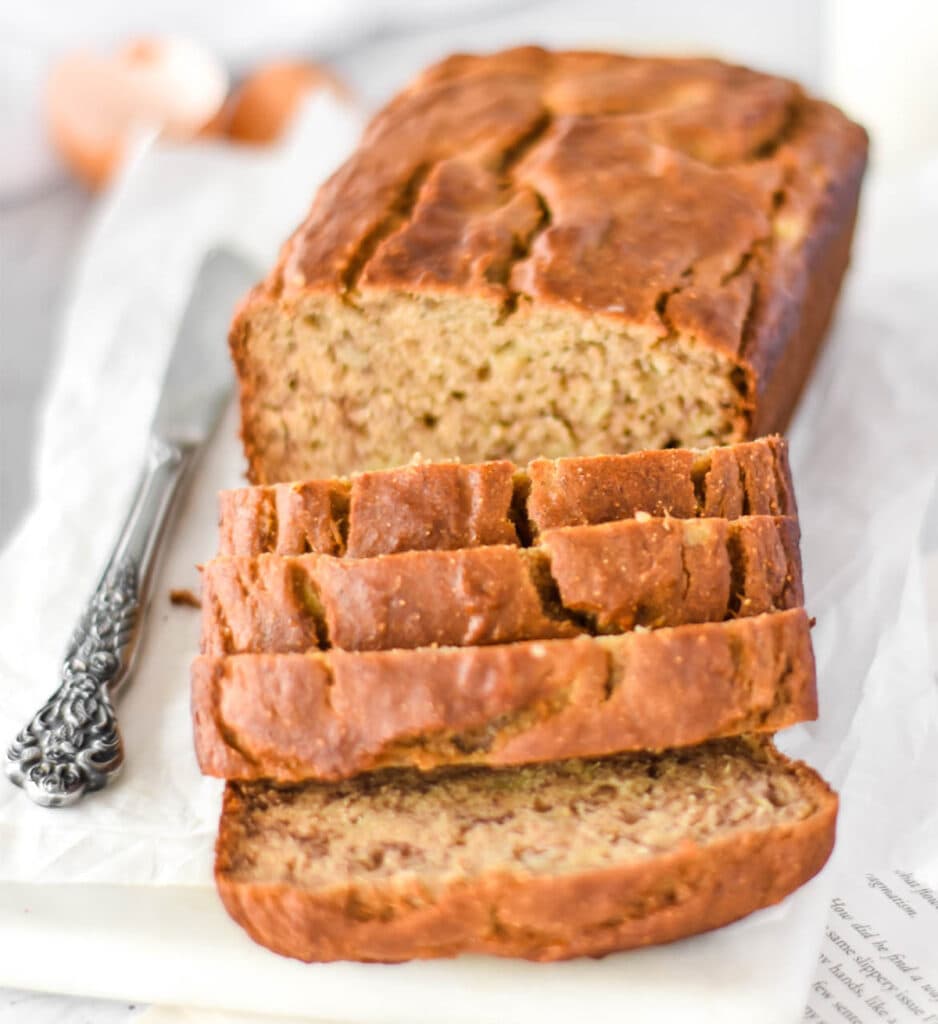 Slicced loaf of banana bread made with chickpea flour.