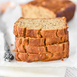 Stack of four slices of chickpea flour banana bread.