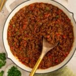 Skillet with paleo sloppy Joe meat with bell peppers and tomato-based sauce.