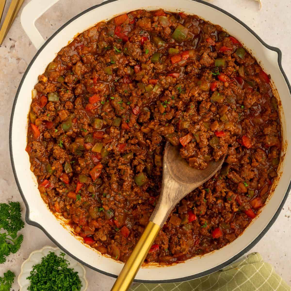 Skillet with paleo sloppy Joe meat with bell peppers and tomato-based sauce.