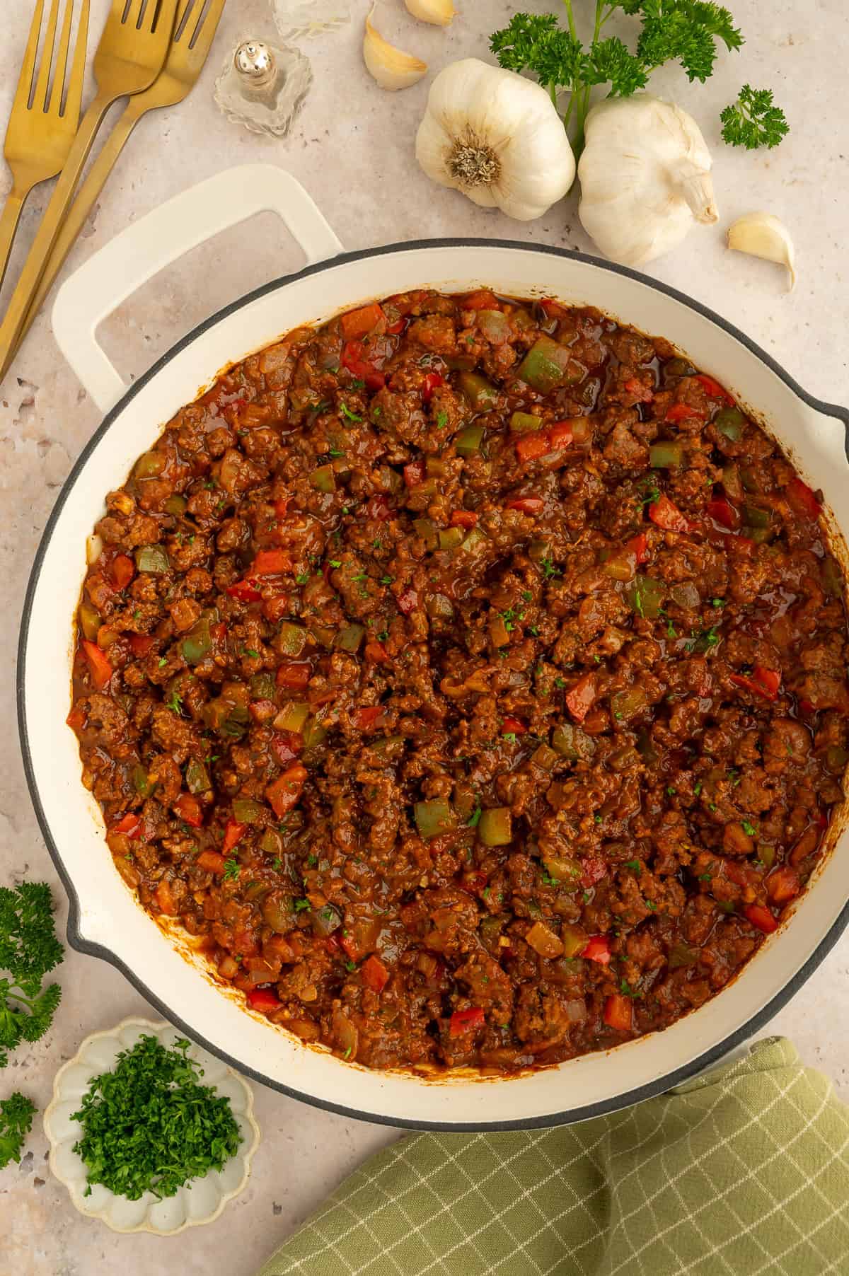 Skillet with paleo sloppy Joe meat with bell peppers and tomato-based sauce.
