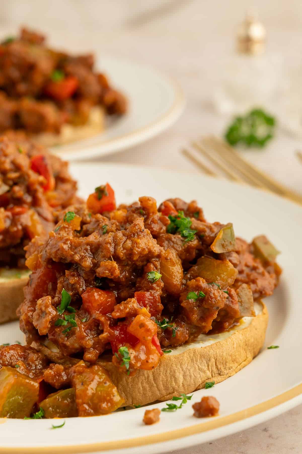 Sweet potato rounds topped with pale sloppy Joe mixture.