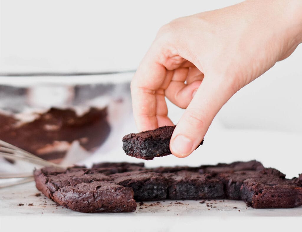 Hand grabbing a brownie.