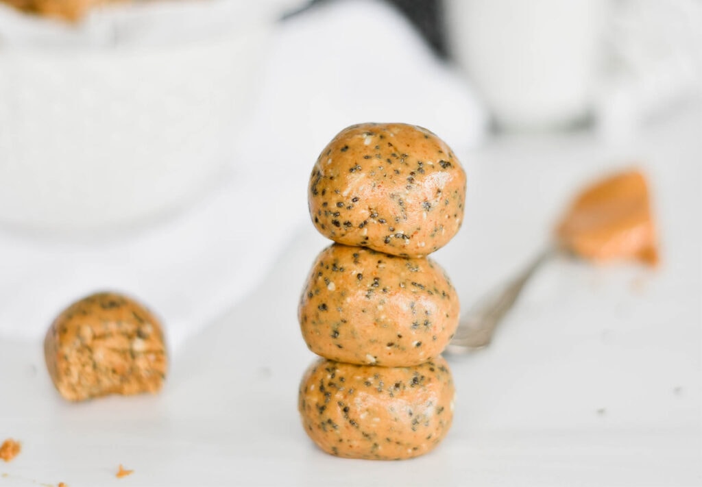 Stack of peanut butter chia protein balls.