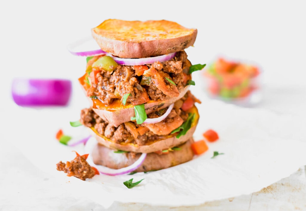 Triple decker Whole30 sloppy joe with red onion and sweet potato rounds instead of buns.