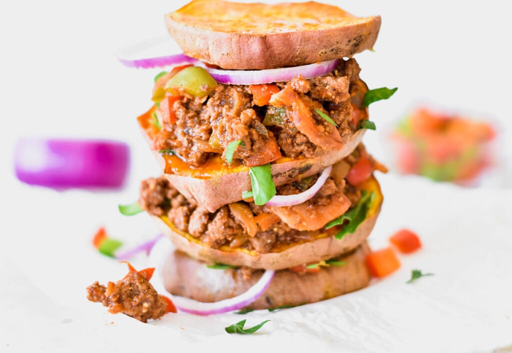 Triple decker Whole30 sloppy joe with red onion and sweet potato rounds instead of buns.