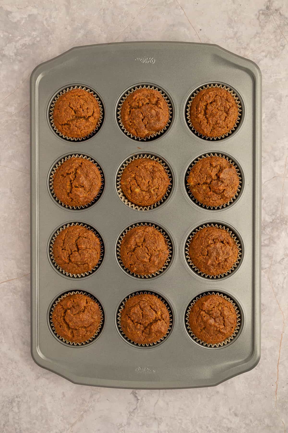 Baked paleo banana espresso muffins in a muffin tin.