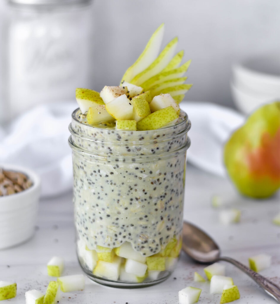 Mason jar filled with overnight oats and pears.