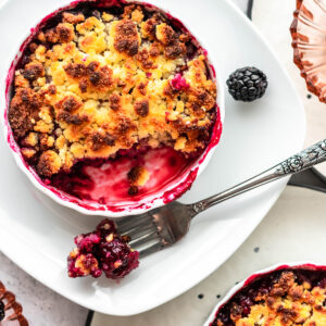 Keto blackberry cobbler with brightly colored blackberry filling.