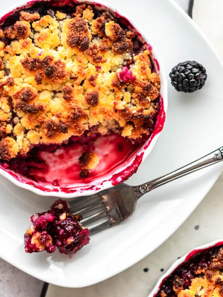 Keto blackberry cobbler with brightly colored blackberry filling.