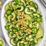 Platter with Vietnamese cucumber salad topped with crushed peanuts.