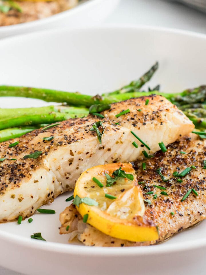 Pan-Seared Halibut coated with seasoning, butter, herbs and lemon.