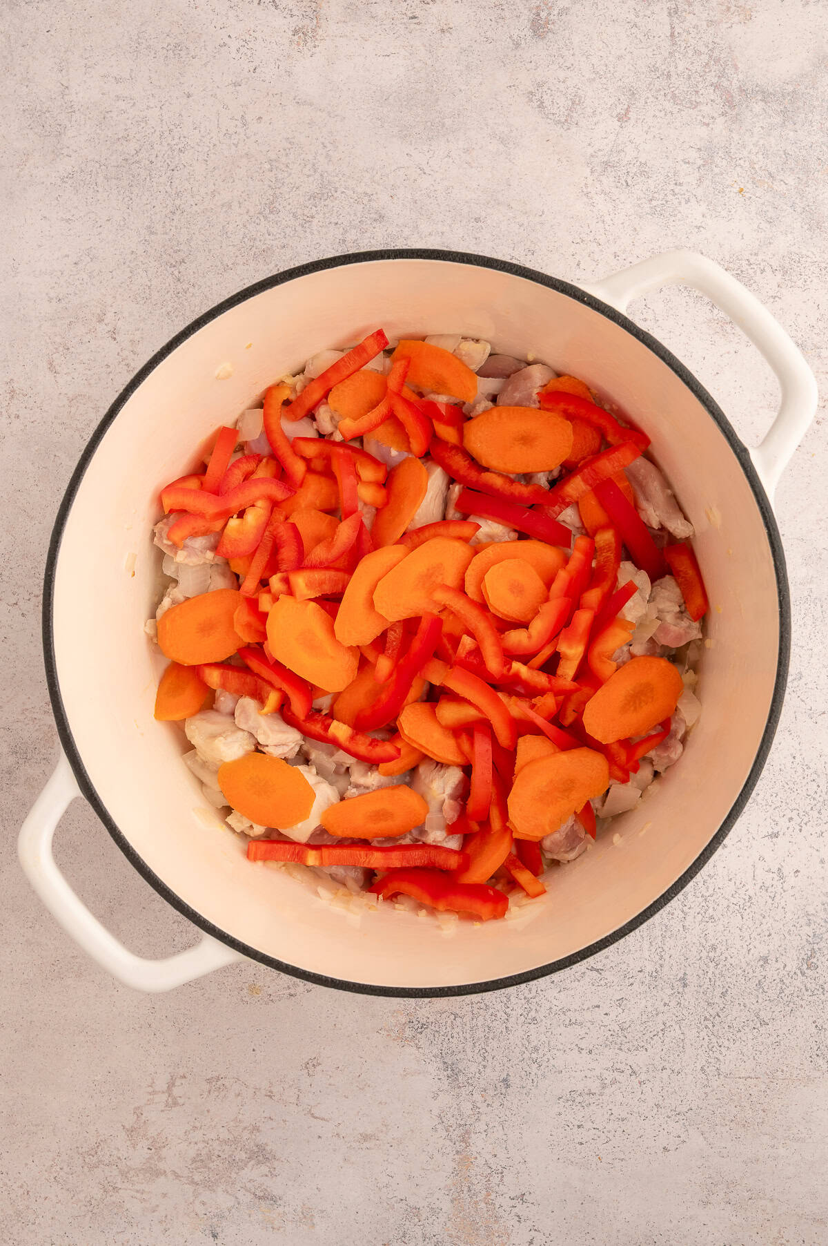 Bell peppers and carrots added to stock pot.