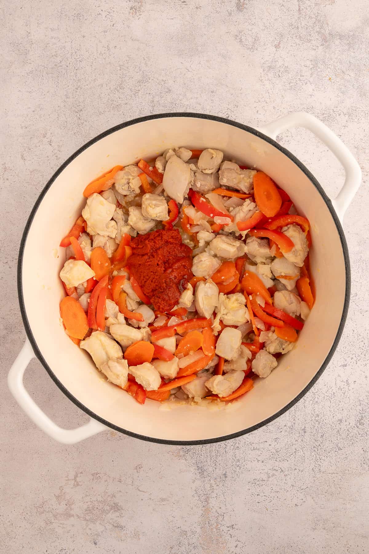 Curry paste added to stock pot.