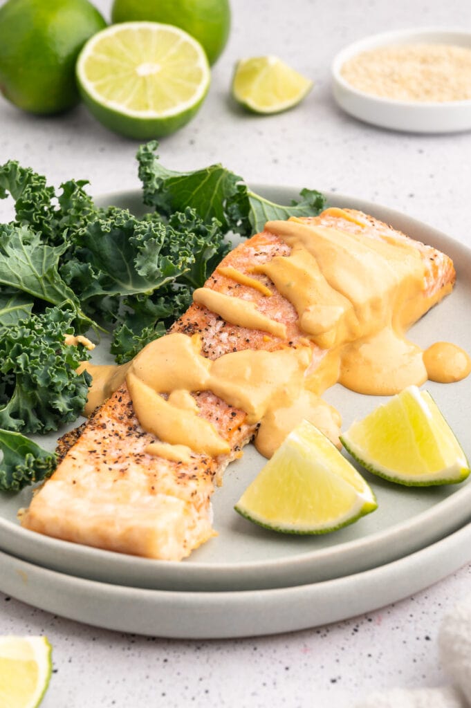 Spicy tahini sauce drizzled on top of salmon.