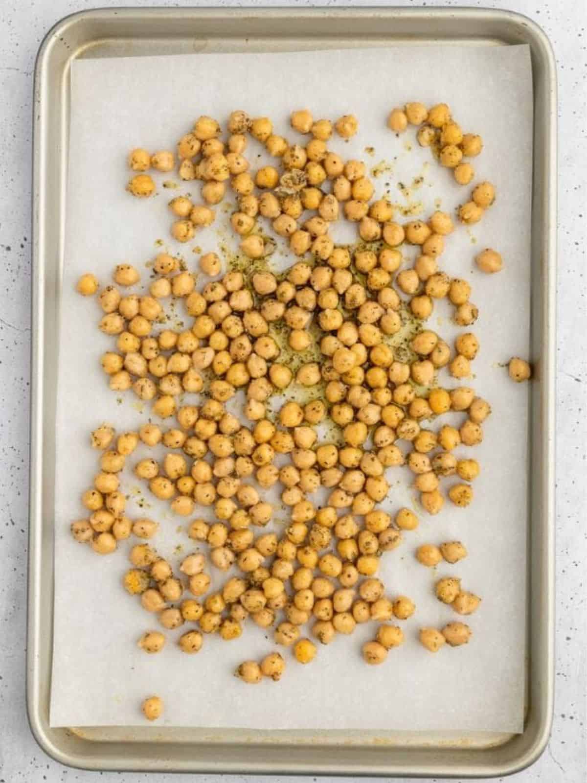 Mediteranean chickpeas on baking sheet before baking.