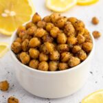Bowl of Mediterranean roasted chickpeas with lemons.