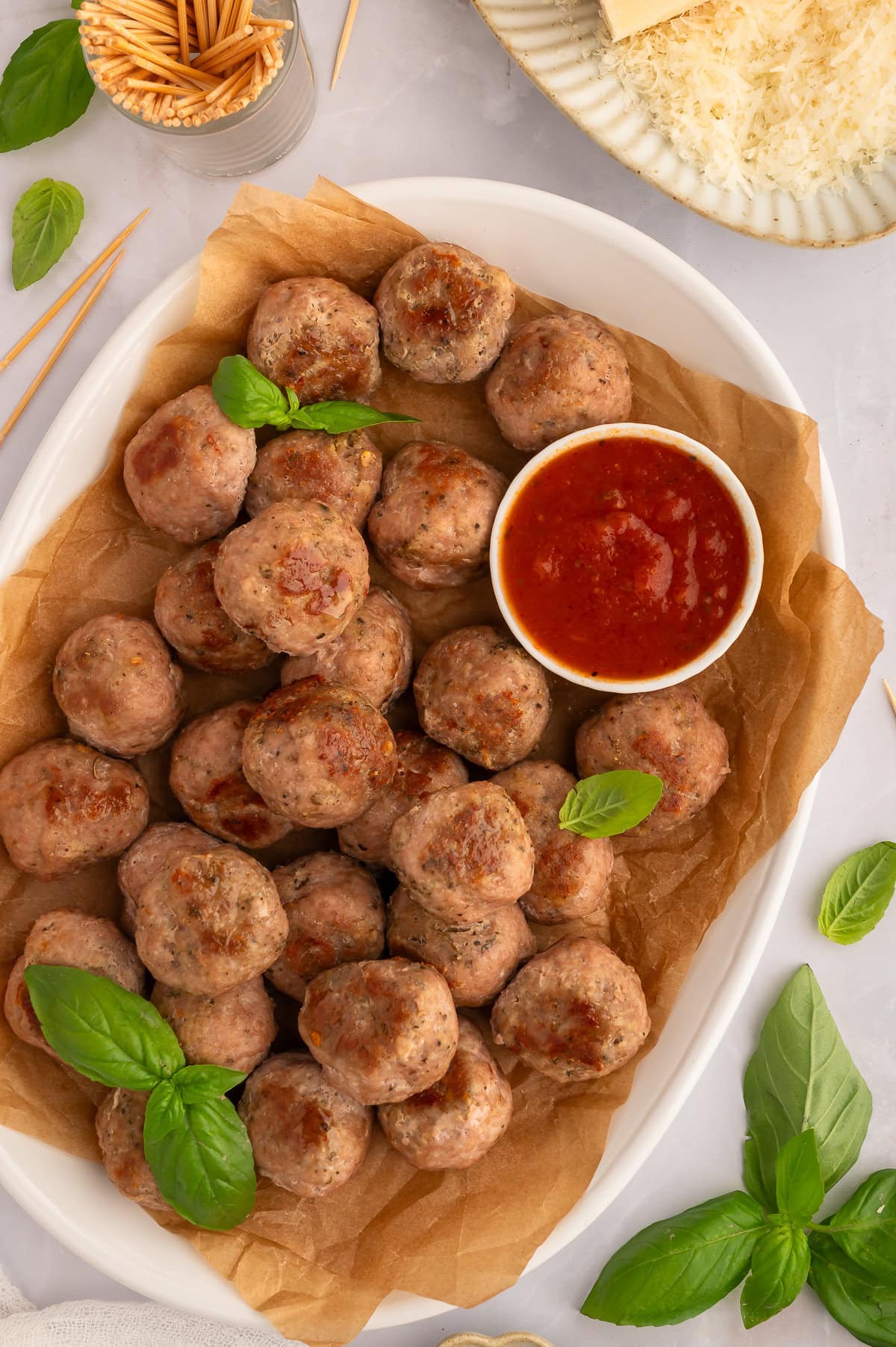Platter of keto turkey meatballs with side of marinara sauce.