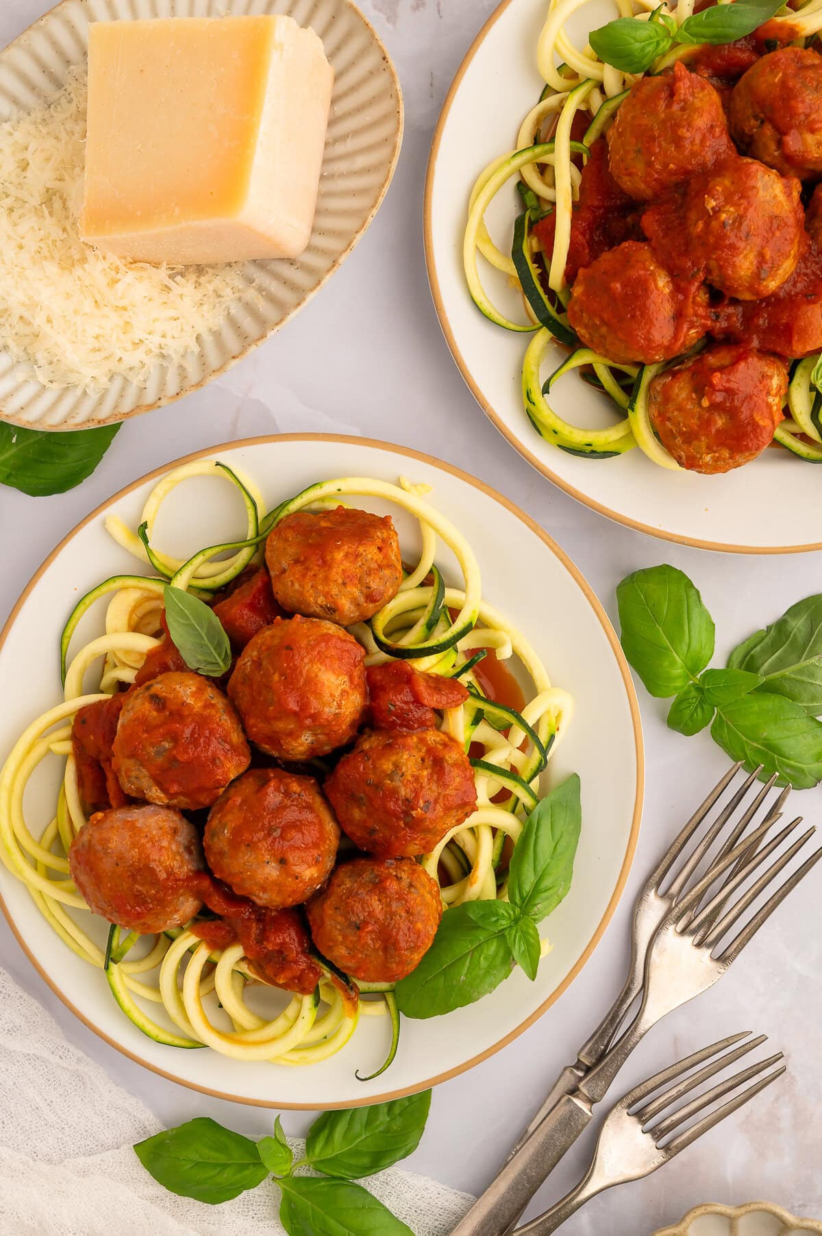 Plate of zucchini noodles with marinara and keto turkey meatballs.