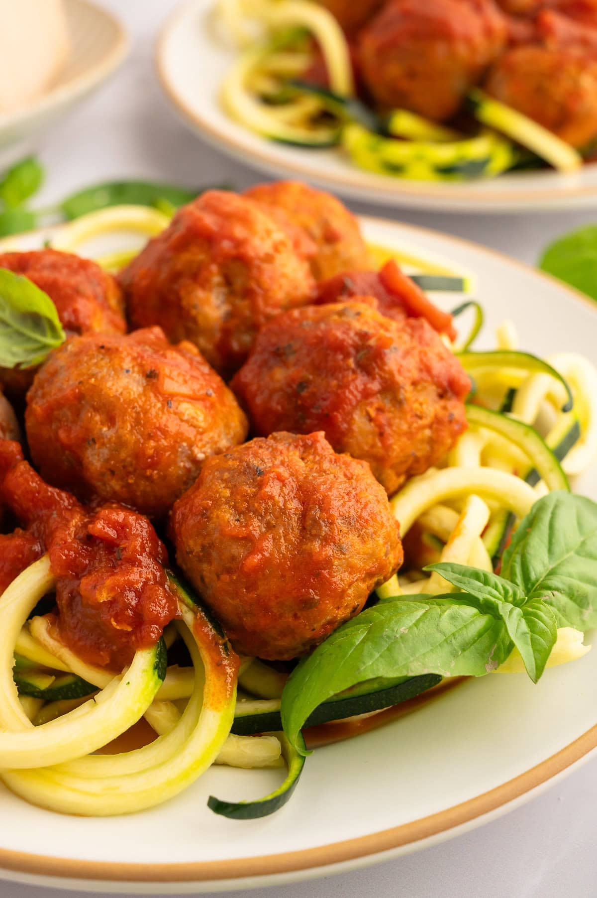 Plate of zucchini noodles with marinara and keto turkey meatballs.