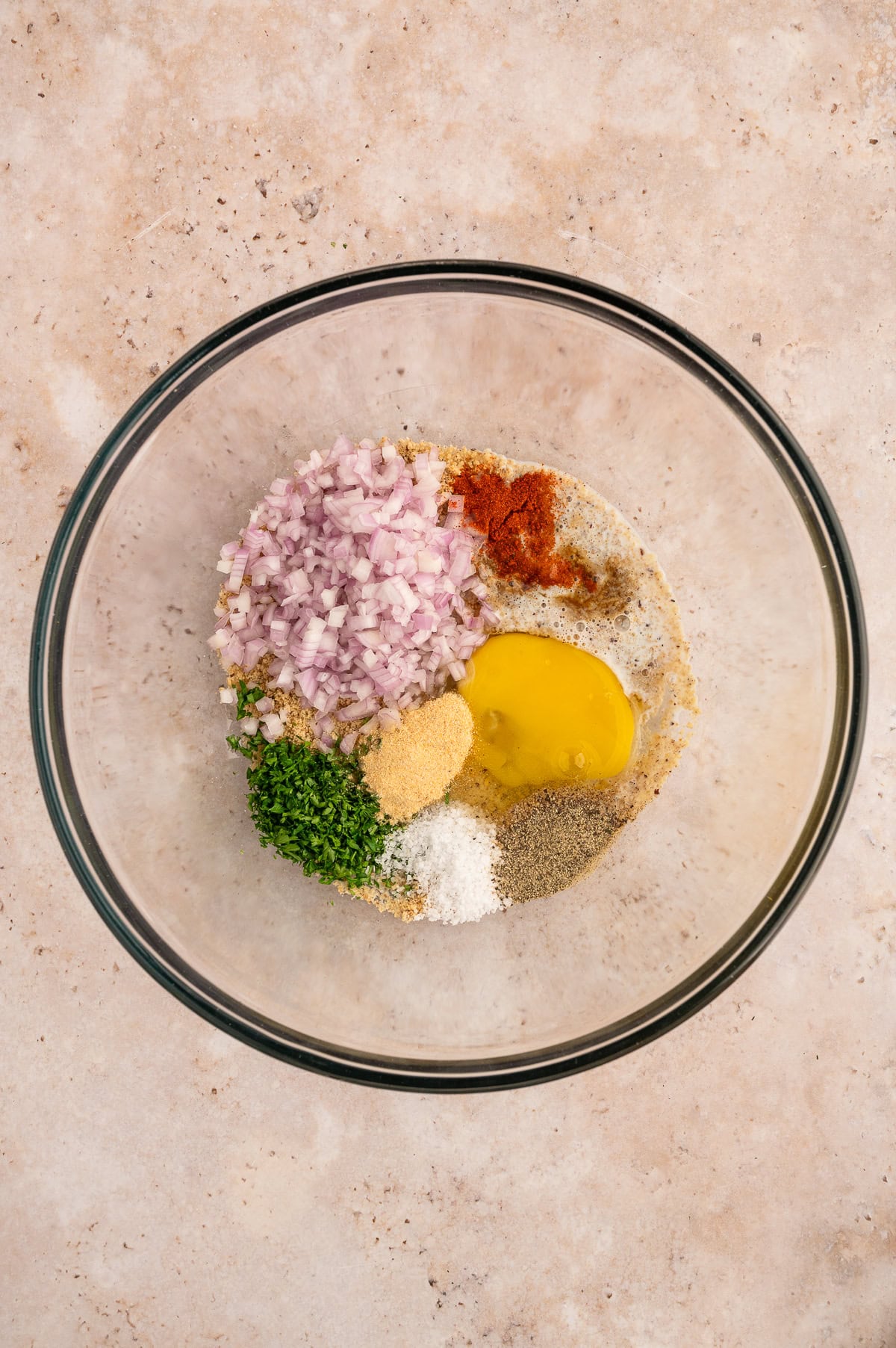 Mixing together parade for wagyu beef meatballs.