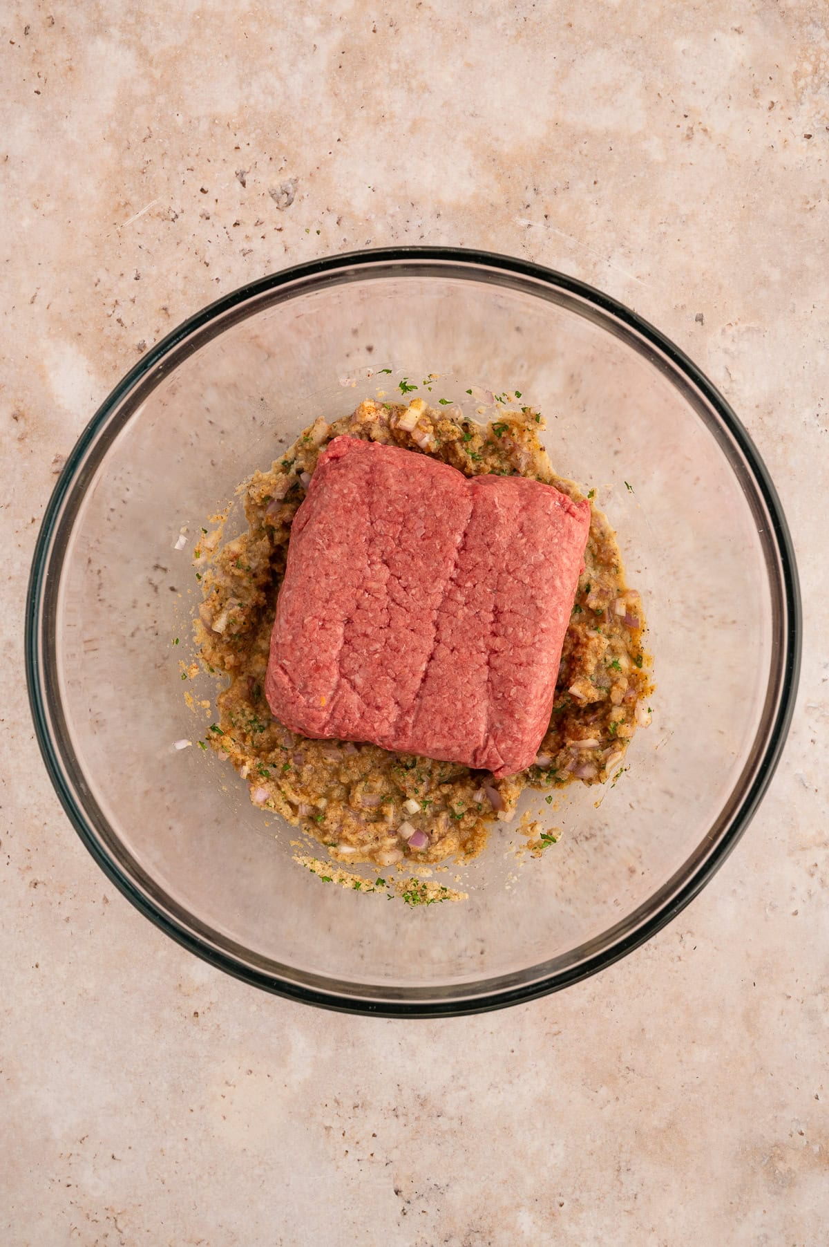 Adding wagyu ground beef to parade.