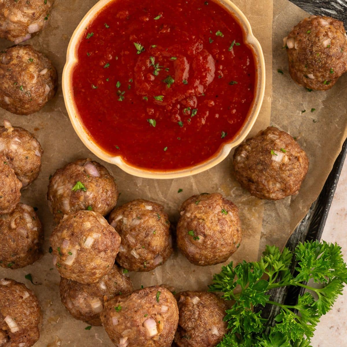 Pan with Wagyu Beef Meatballs and marinara sauce.