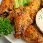 Close up of gluten-free chicken wings with celery.