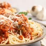 Plate of gluten-free meatballs Lon gluten-free spaghetti with marinara and parmesan.