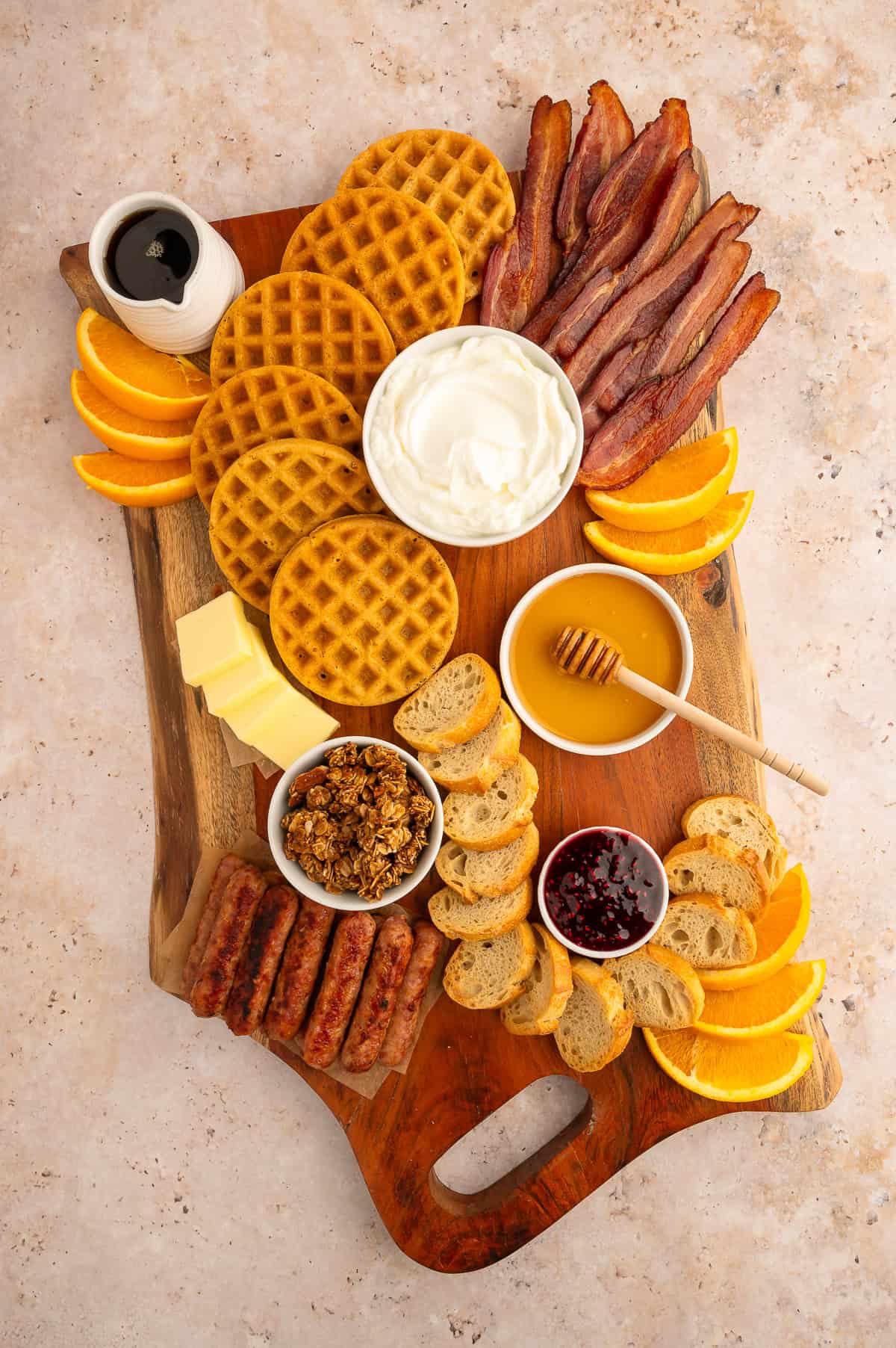 Filling the board with medium sized items for brunch charcuterie board.